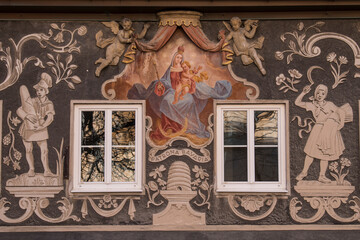 Garmisch-Partenkirchen, Germany - December 22,2021: The traditional mural style on the facades of buildings in the German federal state of Bayern.