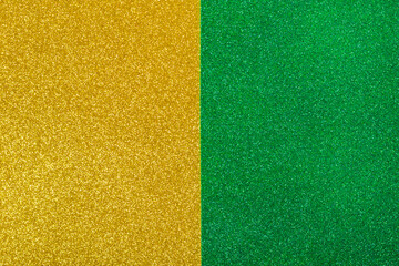 Yellow and green wrapping paper background with metallic sheen. Double color yellow green shiny paper background, copy space. Fashion texture, minimal concept, flat lay, top view.