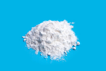 Baking soda on blue background.