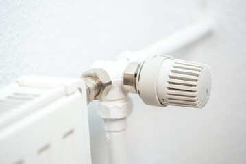 heating regulator knob thermostat on a room heating radiator