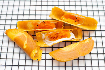Thai crispy pancakes on white background.