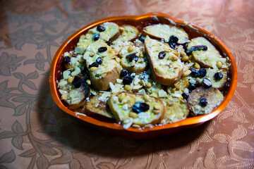 Capirotada is a traditional Mexican food made with birote (artisanal bread), sweetened with milk.