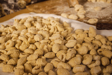 hands kneading gnocchi, woman working with dough