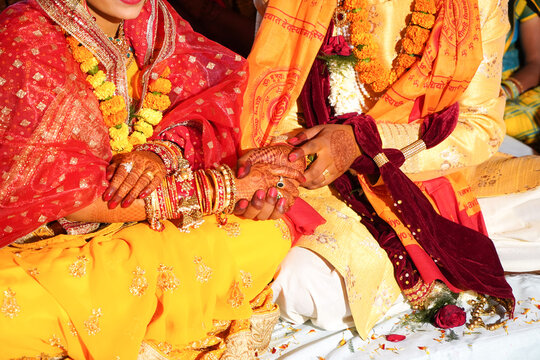 Indian Hindu wedding rituals bride and groom holding during marriage.