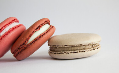 Sweet colorful macarons isolated on white background. 