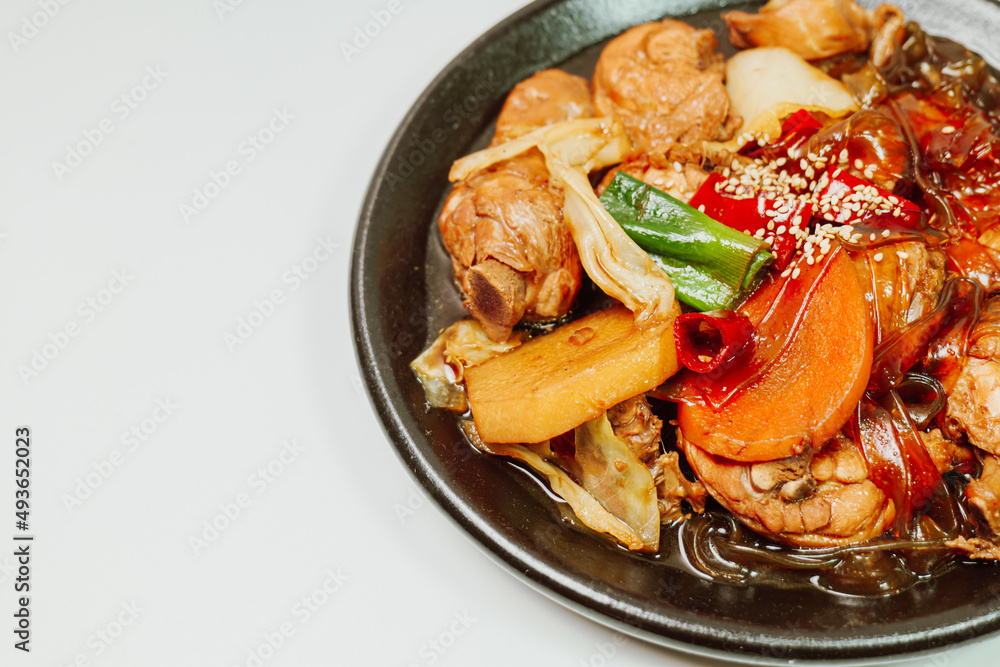 Wall mural Andongjjimdak, Korean Braised Chicken : To make this dish, chicken is cut into pieces and braised with carrot, potato, and other vegetables, along with a soy sauce-based seasoning. Glass noodles can b - Wall murals