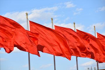 Chinese Red Communist Flags Fluttering in the wind in Beijing, China