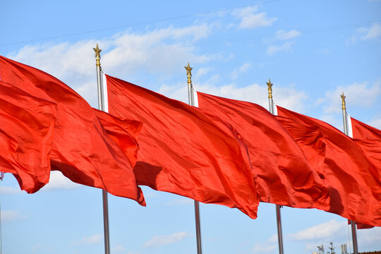 Chinese Red Communist Flags Fluttering in the wind in Beijing, China