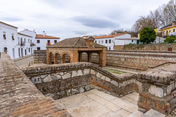 Fototapeta na wymiar historic public laundry installation and fountain in the city square of Aracena
