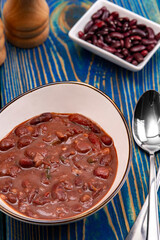 Vegetable soup with red beans, Homemade Soup on blue wooden background , Vegetarian Food