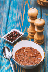Healthy bean soup with red beans, Homemade Soup on blue wooden background , Vegetarian Food.
