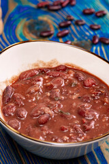 Healthy bean soup with red beans, Homemade Soup on blue wooden background , Vegetarian Food.
