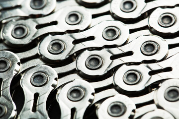 The texture of a bicycle chain is a close-up of the torque transmission links