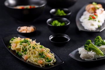 Various dishes of Asian cuisine with different types noodles and rice with shrimp, duck, vegetables...