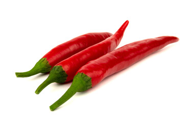 Three Red chili peppers isolated on a white background