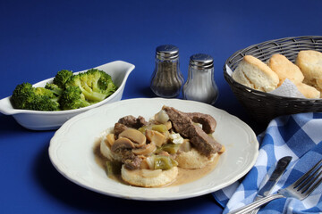 Steak Strips and Vegetables Over Hot Buttered Biscuits