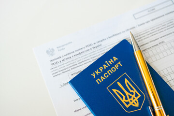 PESEL document, Ukrainian passport on white background.