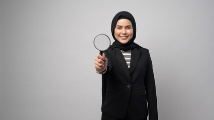 Muslim business woman holding Magnifier isolated on white background