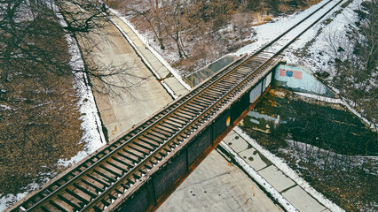 Old railroad track bridge in rural area