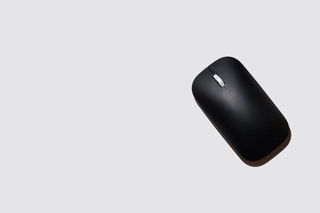 wireless black computer mice on a gray background