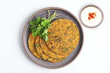 Indian flat bread,Methi Paratha,an Indian flatbread stuffed with fenugreek leaves and spices served with yogurt in breakfast or brunch 
