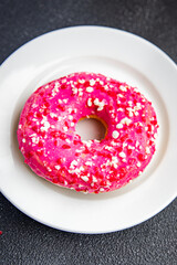 donut pink icing sweet dessert fresh portion healthy meal food diet snack on the table copy space food background rustic top view