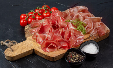 Italian prosciutto crudo or jamon. Raw ham.