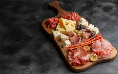 Appetizers table with differents antipasti, charcuterie, snacks and cheese. Buffet party. Top view, flat lay, copy space, negative space