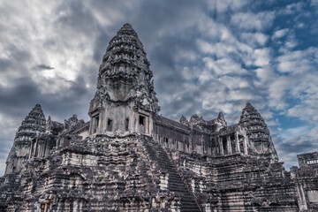 Rich stone carving on towers of central part of Angkor Wat ancient Khmer temple, Siem Reap, Cambodia