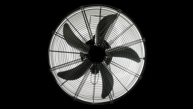 Fan turbine behind a dark surface. Electric fan produce a current of air by slow movement of blades.