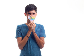 Happy gay man, wearing rainbow corsage, with new LGBT or pride flag.