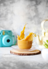 Dalgona coffee in transparent glass cup.