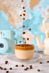 Dalgona coffee in transparent glass cup.