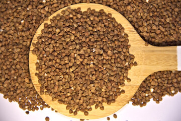 Buckwheat in a kitchen spatula. Top view.