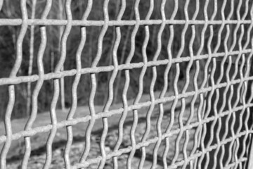 Construction of a fence in the form of a lattice to protect against falling down. Black and white photo
