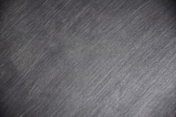 Old metal sheet in black gray with polished diagonal pattern lines. bright white light background