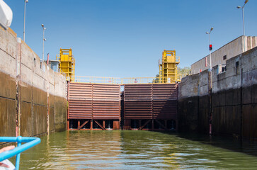 Lock gates of the water dam in river.