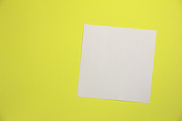 Square sheet. On a yellow background. Top view.