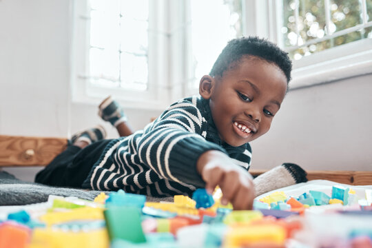 Come And Play With Me. Shot Of An Adorable Little Boy Playing With Building Blocks At Home.