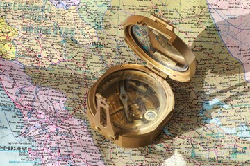 damaged compass and map