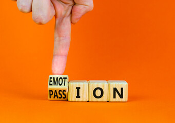Passion or emotion symbol. Businessman turns a wooden cube and changes the word Emotion to Passion. Beautiful orange table, orange background, copy space. Business, passion or emotion concept.