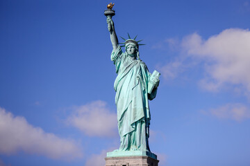 Fototapeta premium The Statue of Liberty in New York against a blue sky