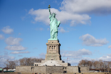 The Statue of Liberty in New York against a blue sky