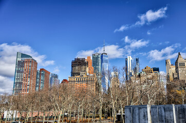 Views of Battery Park and the financial district from the water and Ellis Island in New York City