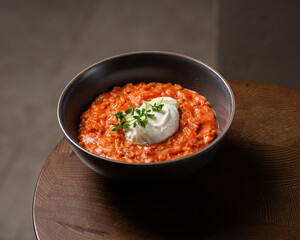 Breakfast oatmeal porridge with roasted egg and tomatoes. Healthy balanced food
