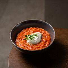 Breakfast oatmeal porridge with roasted egg and tomatoes. Healthy balanced food