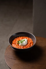 Breakfast oatmeal porridge with roasted egg and tomatoes. Healthy balanced food