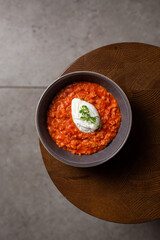Breakfast oatmeal porridge with roasted egg and tomatoes. Healthy balanced food