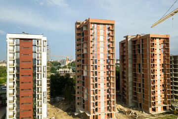 High residential apartment buildings under construction. Real estate development.