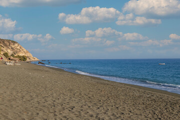 Summer landscape of Crete island in Greece in Europe. Coast in the Larapetra region. In the background is a sunny sky with clouds.
